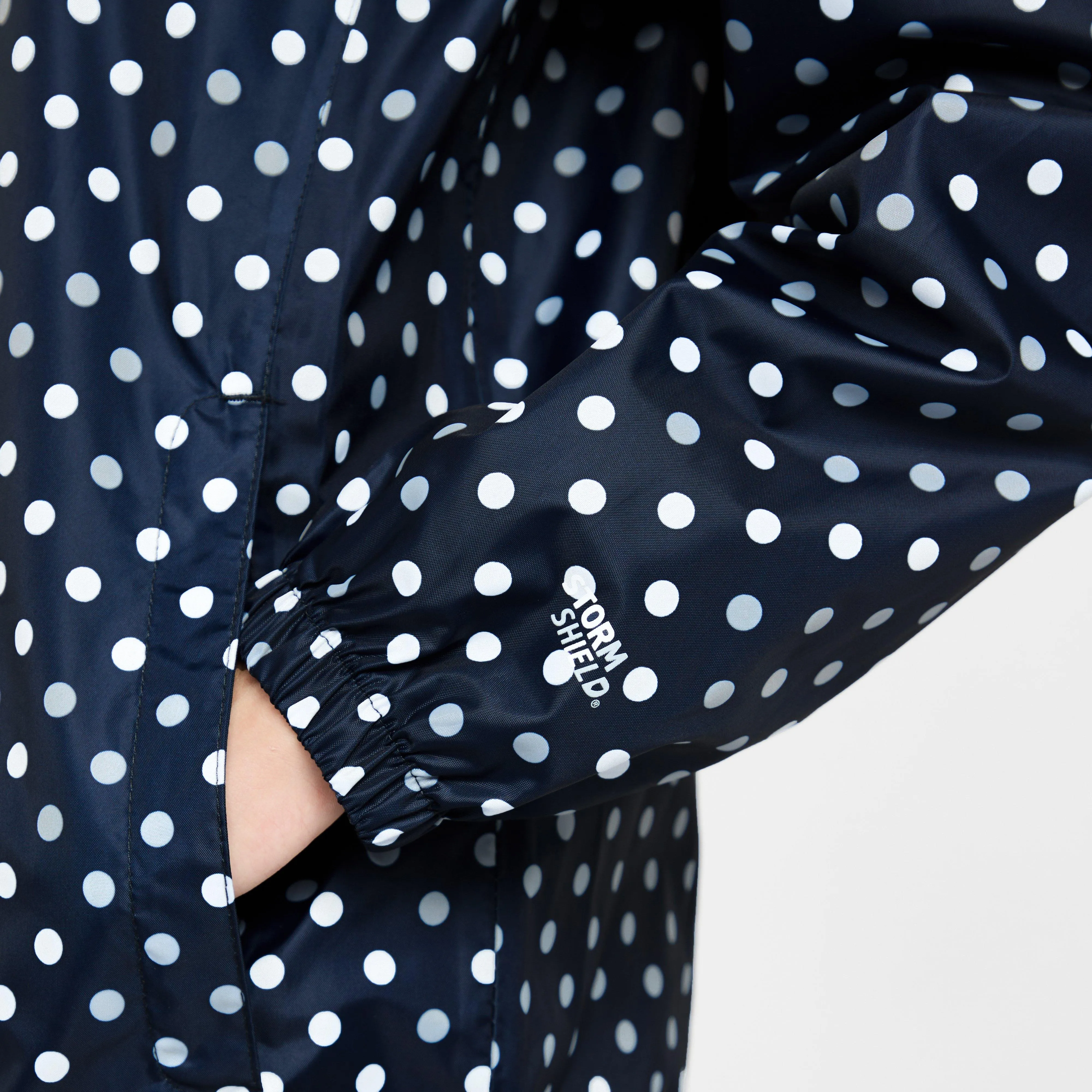 Peter Storm Kids Packable Waterproof Jacket Navy/White Polka Dot | Millets